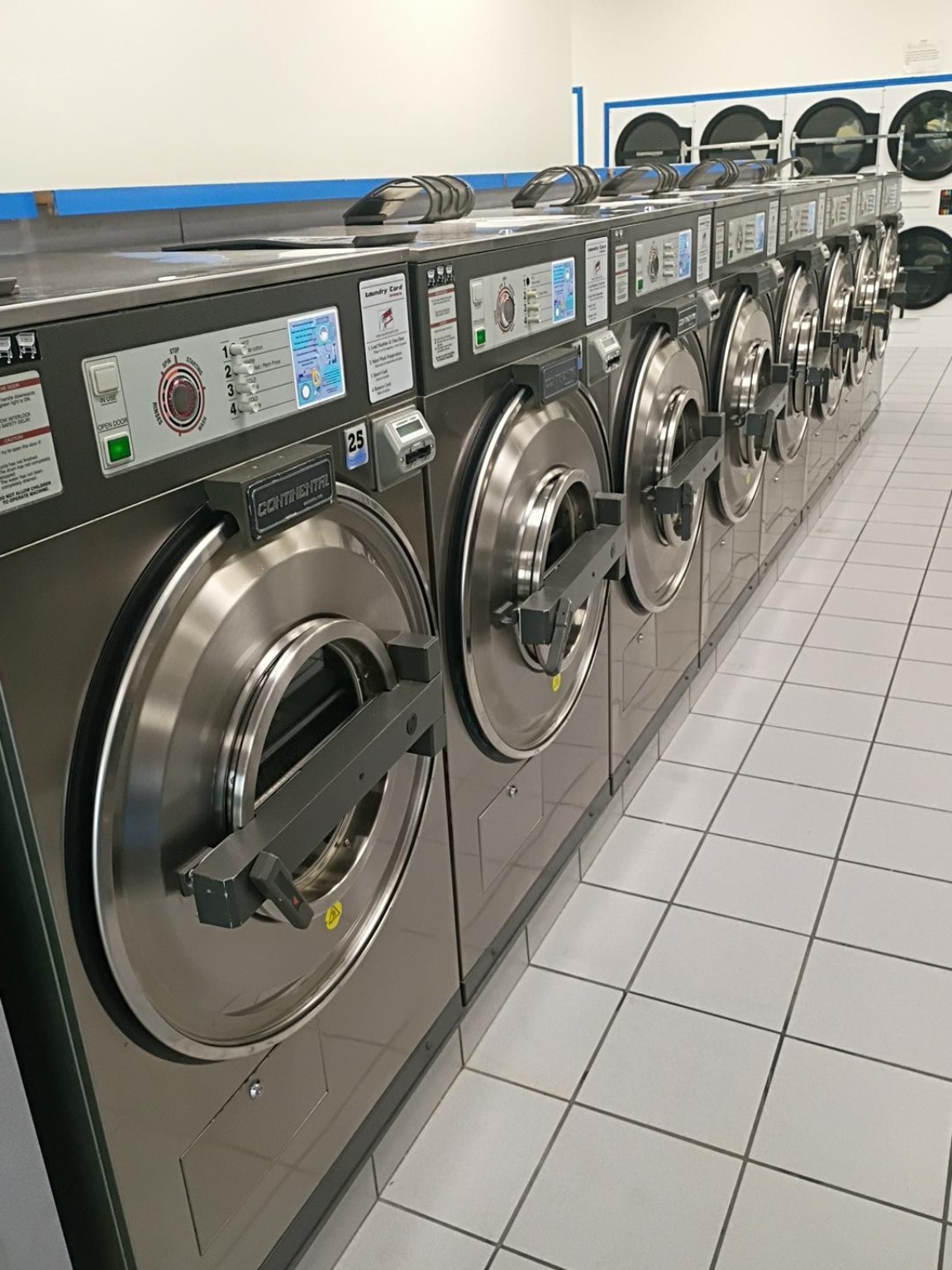 Long row of washers inside Rio Laundry