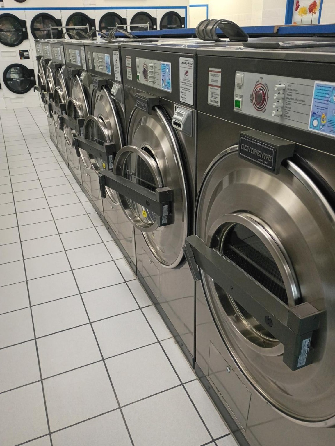 Angled view of front-load washers at Rio Laundry