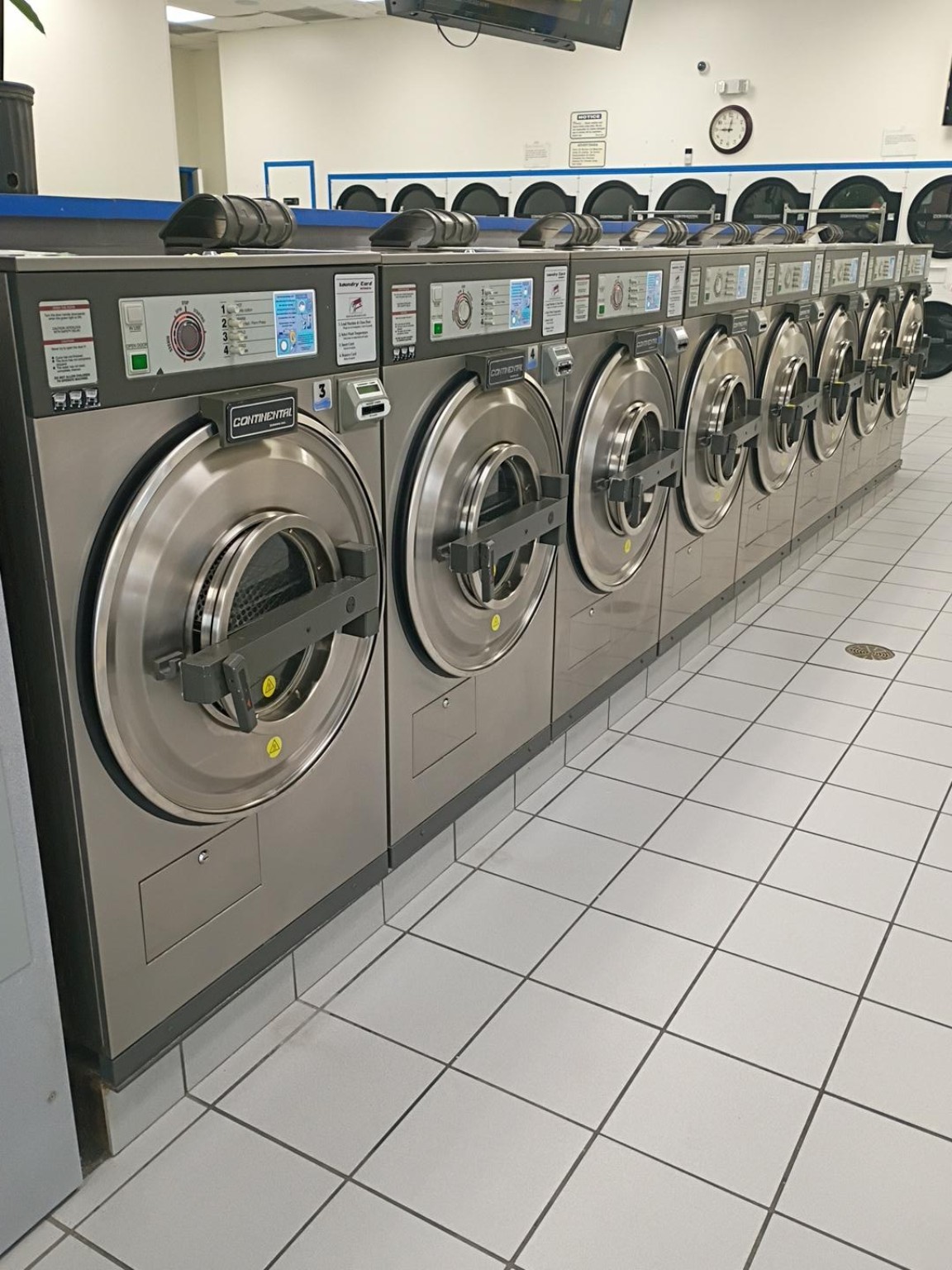 Row of front-load washers at Rio Laundry
